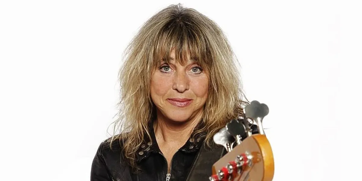 Suzi Quatro portrait with bass headstock